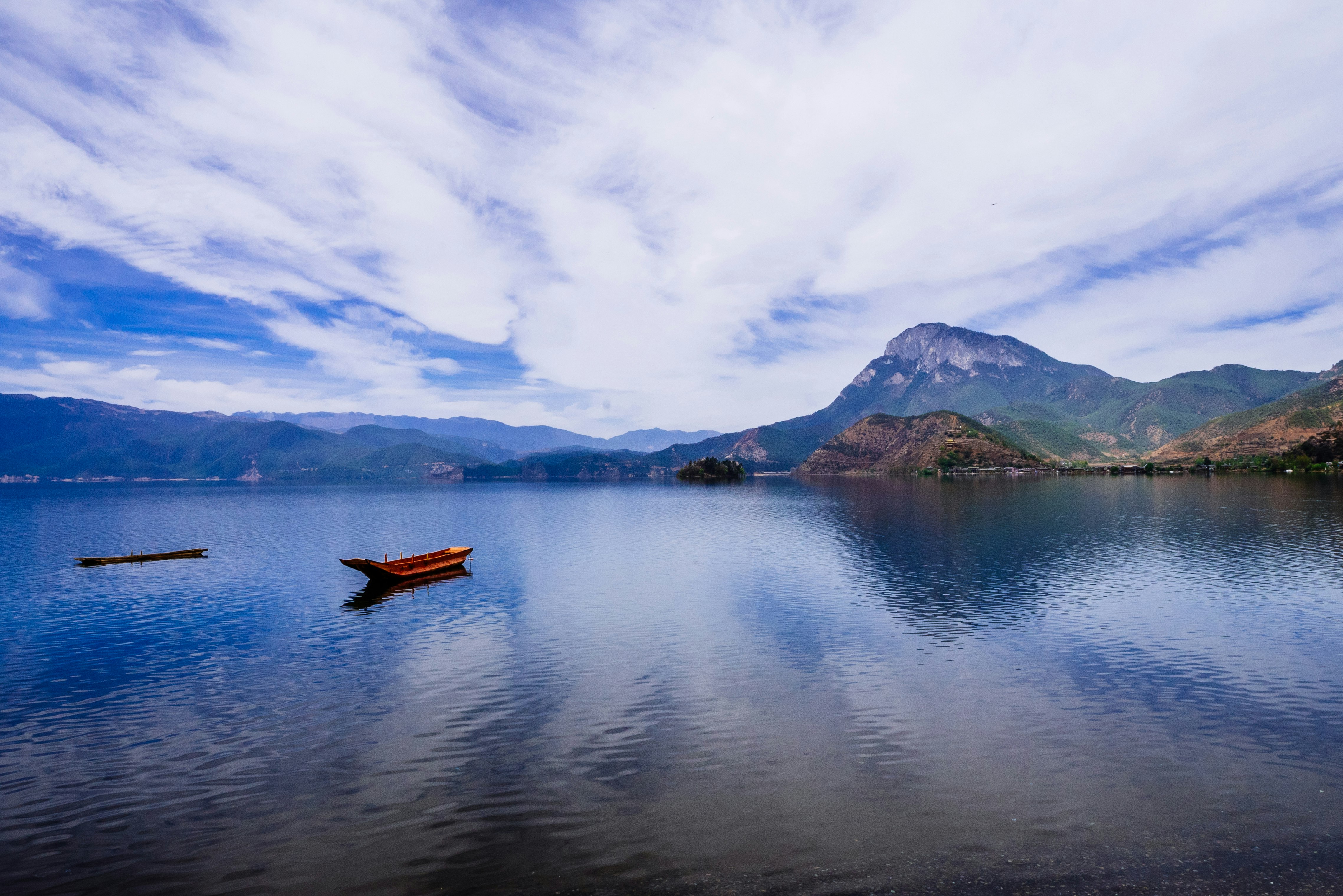 red boat on body of water